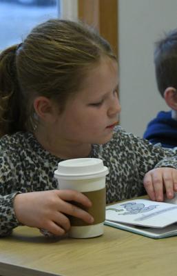 Olivia McPhillips and Landon May enjoyed some hot chocolate, popcorn and reading books that were brought to Studio C by Ms. Tiffany and Mrs. Gathje. Students had the opportunity to read on their own after volunteers read to them.