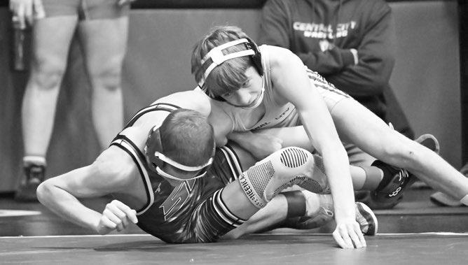 CENTRAL CITY’S ACE SCHWEITZER takes down Heustyn Roesler of St. Paul. Schweitzer pinned the Wildcat in thirty-one seconds. Photo by Michael Happ