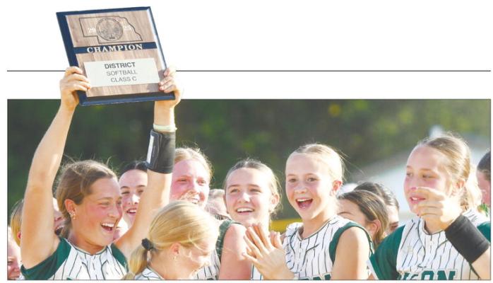 THE CENTRAL CITY HIGH SCHOOL softball team punched its ticket to the NSAA Class C State Softball Tournament last Friday with a pair of victories over Twin River in the Class C Subdistrict C-7 Tournament on their home field. The Bison beat the Titans 8-6 and 16-5 to secure their spot at state. Above, Payton Burbach hoists the championship plaque following last week’s second victory. Photo by Jordan Coslor