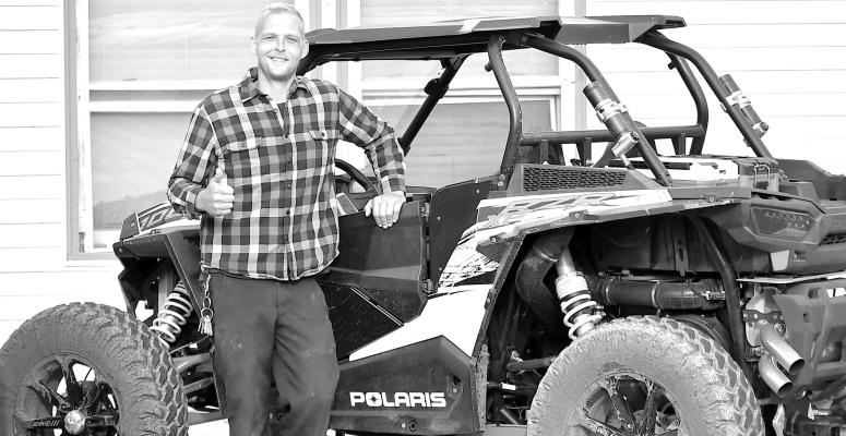 All Legal Central City resident Elliot Grosshans smiles after being one of the first local residents to take advantage of the new Alternative Vehicle ordinance that took effect last Friday. Once his UTV was registered, Grosshans was legal to travel on Central City streets.