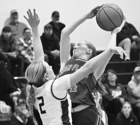 HIGH PLAINS’ PEYTON HOFMANN battles against Elba’s Addison Wysocki during the second half of last week’s game between the Storm and the Bluejays. Photos by Michael Happ