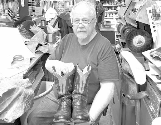 Russ in Central City When the Husker volleyball team took the court at the Bison Activity Dome there was a lot of conversation surrounding the attire of their coach including a custom pair of boots. Those boots were made by Russ