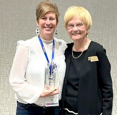 In December, Merrick County Assessor Jen Myers (left) was joined by NACO President Judy Mutzenberger (right) as she was presented with the organization’s Next Generation Award for her work in Merrick County.