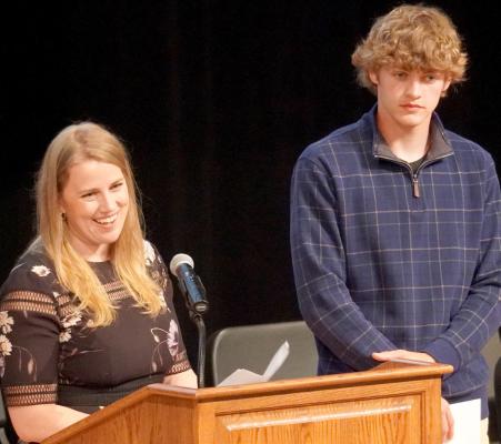 Generosity on Display Courtney Retzlaff and Truman Ryan stand on stage during the scholarship event Sunday at the Performing arts Center.