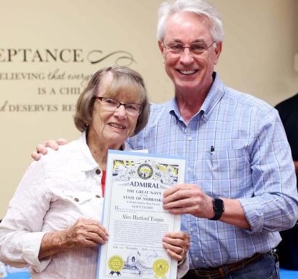 Well-Deserved Having lived a full life, Alice Torpin added another honor as Senator Loren Lippincott presented her with an Admiral honor.