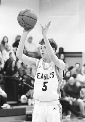 QUENTIN HERMAN knocks down a three-pointer in the Eagles’ 74-31 win over Palmer last Thursday.