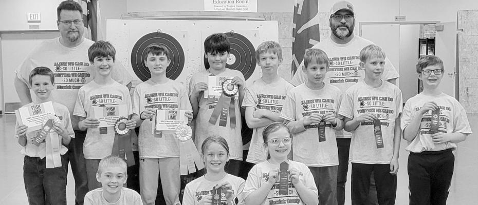 Junior Archery Back row L to R: Coach Aaron Blanchard, Coach Bob Kosmicki Middle row L to R: TJ Friedrichsen, Elijah Parde, Mercer McHargue, Dustyn Douglass, Emmett Stettner, Eli Schweitzer, Winston Schweitzer, Lucas Musil Front row L to R: Aleric Frey, Matilda Paup, Kacie Kosmicki Courtesy Photo