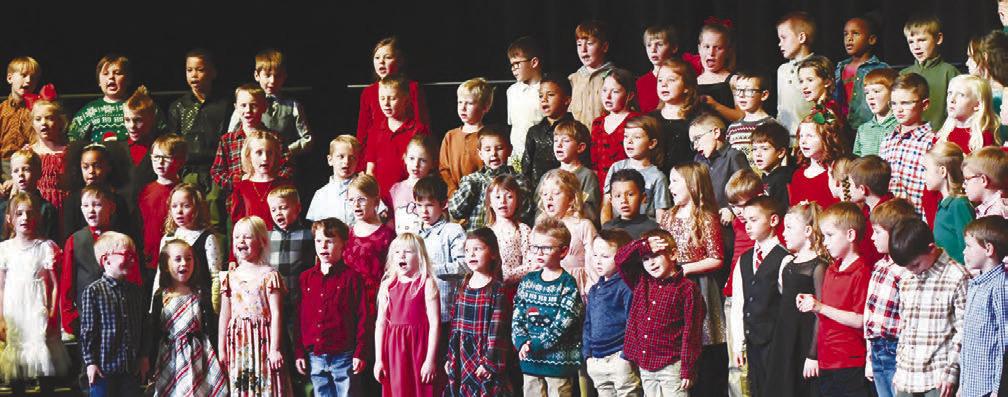 STUDENTS at Central City Elementary School sang a series of holiday melodies on Monday night during the school’s annual Christmas program at the Performing Arts Center. Above, first and second graders perform for a packed audience during the concert, which was themed Counting to Christmas. Photo by Jordan Coslor