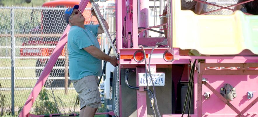 Bringing the Fun If there is one thing that DC Lynch Shows knows, its how to bring the fun. This week the carnival was a hit in Central City as part of the Merrick County Fair. Monday morning Mike Lynch and his crew were busy setting up for three days of exciting action. (R-N Photo by Jacob Kennedy)