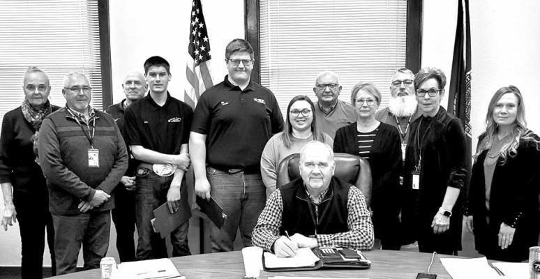 Tuesday morning the Merrick County Board of Supervisors were joined by leaders of the Merrick County 4-H for their annual proclamation, that was signed by Chairman Wiegert, naming March as 4-H Month here in Merrick County. (Courtesy Photo)