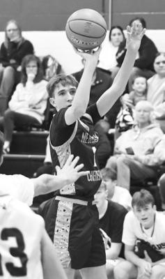 LUKE POWELL connects on a three-pointer in the first quarter of Nebraska Christian’s Goldenrod Conference Tournament game with Central Valley. Photo by Jordan Coslor