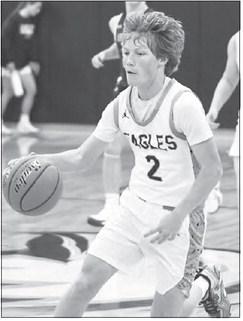 JACOB SWANSON leads a fast break in last Tuesday’s game between Nebraska Christian and Archangels Catholic. Photo by Jordan Coslor