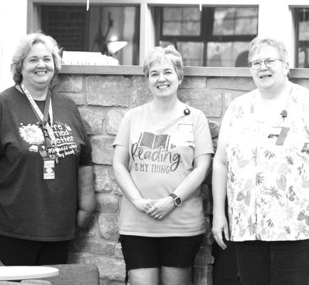 Cozied Up The Central City Public Library opened back up this past month and visitors have been pleased with recent renovations. The two-sided fireplace has been a hit and the staff, including left to right, Lori Hood, Sara Lee and Adele Maynard are excited to see progress continue. (R-N story and photo by Jacob Kennedy)