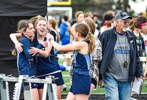 Hannah Swanson rushes to celebrate with Gracie Hackel at the CNTC meet.