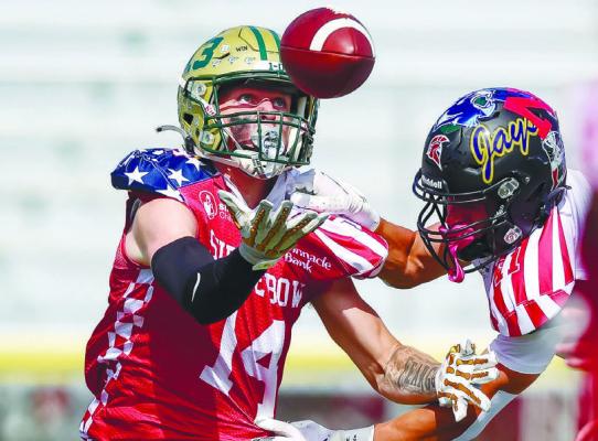 FORMER CENTRAL CITY HIGH SCHOOL STANDOUT Wyatt Dent reaches for a pass while eluding the South team’s coverage during the 68th Annual Shrine Bowl on Saturday afternoon in Kearney. Photos by Jeremy Vauble