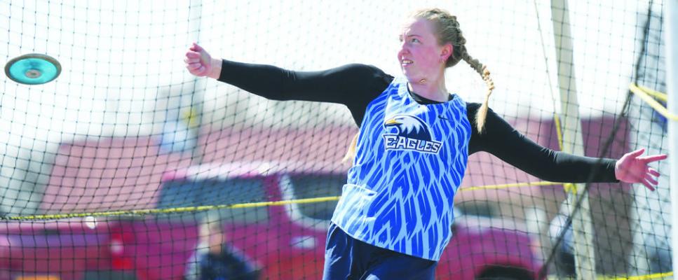REAGAN NORRIS competes in the discus competition at last week’s Wood River Invite. Reagan was one of three Eagles to place in the event, along with Piper Norris and Hananiah Peters, when she earned a silver medal with her best throw of 117-01. Photos by Jordan Coslor