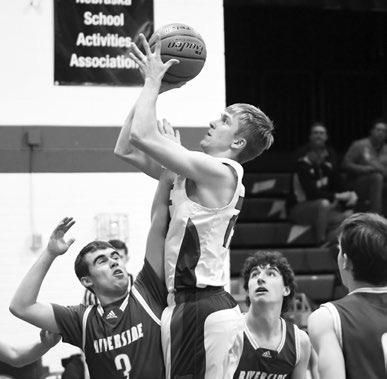 BRODEY SPURLING goes over the Riverside defense and makes a tough shot in the paint during the second quarter of High Plains’ game with the Chargers.