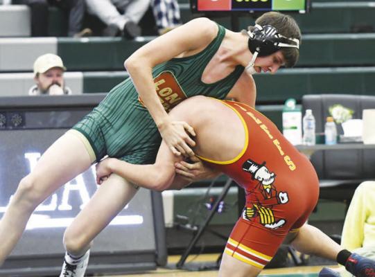 LINCOLN REEVES wrestles Fairbury’s Cesar Galvan in last Tuesday’s Lone Tree Night dual with the Jeffs. Reeves pinned Galvan in 3:09. Photos by Jordan Coslor