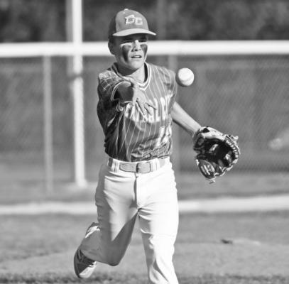 COLTON BOROFF tosses the ball to first base for an out after fielding a bunt in Central City’s 12-9 loss to Aurora. Photos by Jordan Coslor