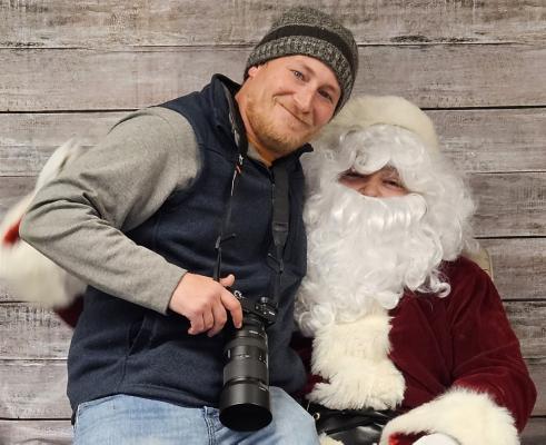 Hey Jake, Get Back to Work! Here at the R-N we certainly enjoy the holiday season. Some of us can’t even resist the temptation, or peer pressure, to sit on Santa’s lap. This photo submission was a great opportunity for us to thank Jacob Kennedy for his continued work in telling area stories. Thank you Jake!
