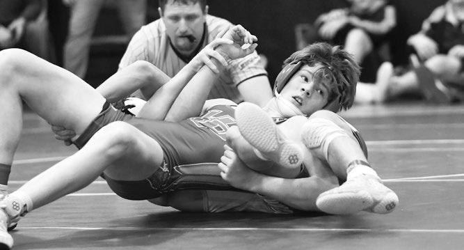 MAKAYO CONFER attempts to pin Riverside’s Hunter Rutten in the 132-pound quarterfinals of the Central Valley Invitational. Confer defeated the Charger 8-5. Photo by Jordan Coslor