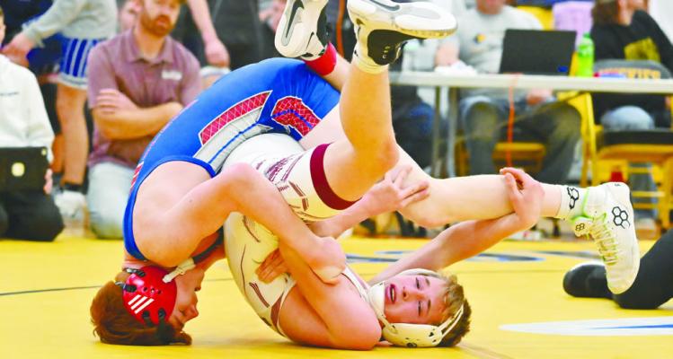 MAKAYO CONFER of High Plains Community needed just under three minutes to pin Neligh-Oakdale’s Bode Koinzan during the first match of the consolation bracket on Friday at Shelby-Rising City. Photos by Michael Happ