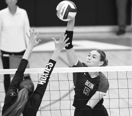 SYDNI HOMOLKA spikes the ball past the Aurora defense for one of her eight kills against the Huskies last week. Photos by Jordan Coslor