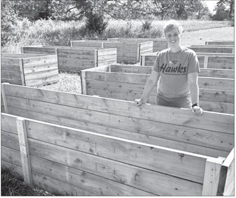 TEE BUSH, who has a doctorate in education and master’s degree in horticulture, shows one of the raised beds where produce can be grown at the Urban Farm. Northeast Community College