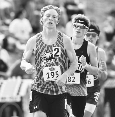 JACOB SWANSON capped his standout varsity career by earning bronze medals in both the 1600- and 3200-meter runs at the NSAA Class C State Track and Field Championships. Photos by Michael Happ