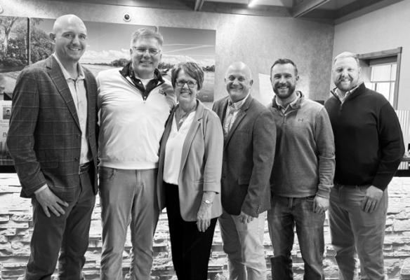 PINNACLE BANK OPERATIONS MANAGER SHARON TIBBETTS, who celebrated her retirement from Pinnacle Bank after forty-two years on Friday, was joined by five of the twelve market presidents she had worked with at the bank during her retirement open house. Pictured above are Market President Tyler Wichmann, Jerry Lentfer, Tibbetts, Kevin Small, Kevin Black, and Wade Regier. Photo by Michael Happ
