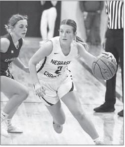 TAYTUM PERDEW dribbles past an Archangels Catholic defender and drives towards the basket.
