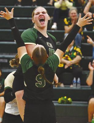 CENTRAL CITY’S HOPE PAUP celebrates with Ava Call following the Bison’s victory in the third set of last week’s LouPlatte Conference showdown with Centura. Despite Central City’s rally in the third frame of the match, the Centurions won the game 3-1. Photo by Michael Happ