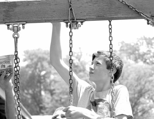Spring Cleaning With summer-like temperatures it is time for outdoor projects and members of two local 4-H clubs, including Eli Ferris, made the most of some beautiful Sunday weather as they revitalized playground equipment at
