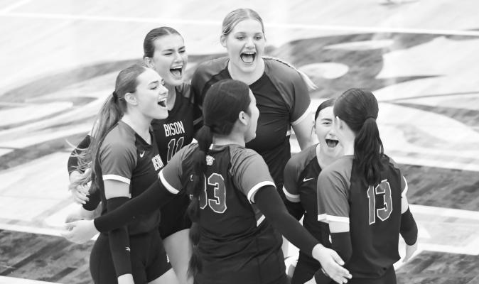 THE CENTRAL CITY BISON celebrate after scoring a crucial point in the fourth set of their season-opening match with Ravenna last Thursday evening. Photos by Jordan Coslor