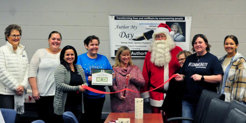Author My Day Ribbon Cutting In just a short time Author My Day and Tammy Stuhr (middle) have made a splash in our community through business coaching, children’s books and even a board game. Last Thursday the Central City Area Chamber of Commerce and other special guests joined Tammy in her ribbon cutting and grand opening event held at the Venture Center. (R-N Photo by Sidney Horne)