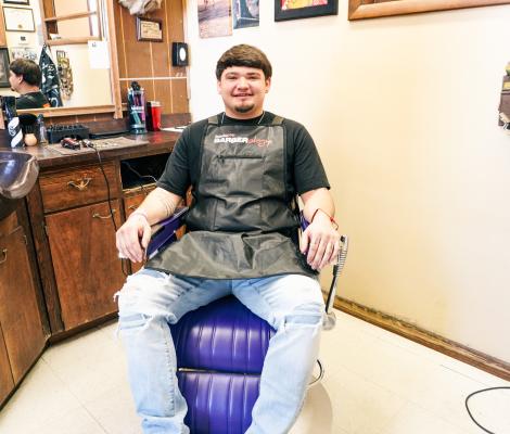Central City graduate and barber returns home to keep local barber shop open