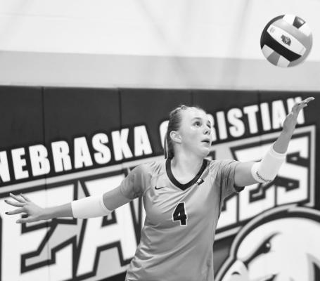 KINLEY MACKEN lines up a serve in Nebraska Christian’s 2-1 win over Elba last week. Macken led the Eagles with twelve kills in the match. Photo by Michael Happ