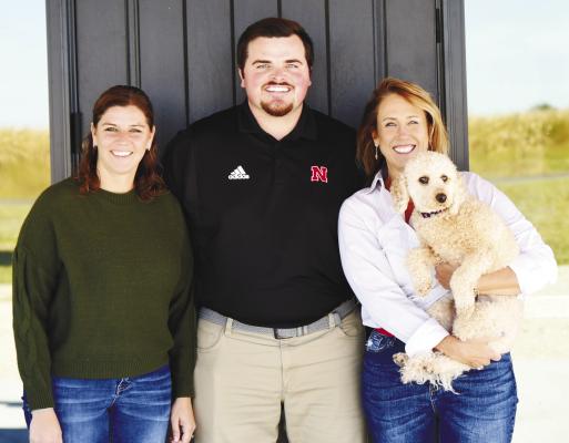 FARM BUREAU FINANCIAL SERVICES team members, including Office Manager and Sales Associate Jessica Brandenburg, Senior Account Executive Brett Santin, Registered Representative Shannon Hannappel, and Lois, are pictured outside their new office north of Central City. Photo by Jordan Coslor