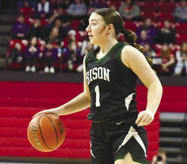 TAYLLEN LEE scans the court, looking to make a pass in Central City’s state tournament game with Milford. Photos by Jordan Coslor
