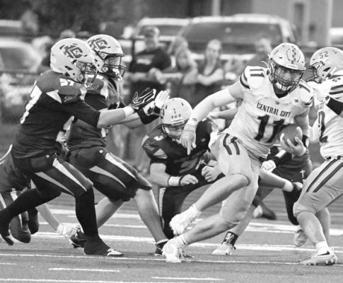TURNER HANKE runs through multiple Kearney Catholic defenders on the way to a big gain in Central City’s 26-14 win last Friday. Photos by Michael Happ