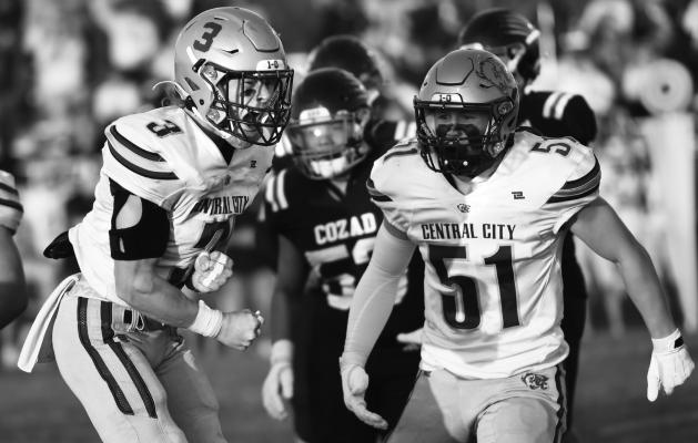 JACOB BRAZEE AND DAMIEN MALACHIAS celebrate after making a stop on third down against Cozad during last week’s game. CORBIN KYES Photos by Jordan Coslor