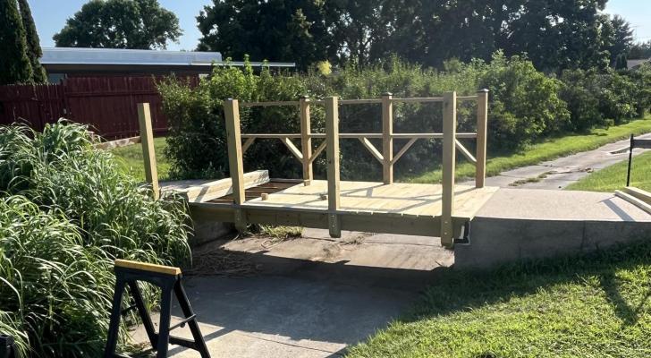 The Oaks Care Center and the Central City United Methodist Church team up to fix the bridge connecting the two properties.