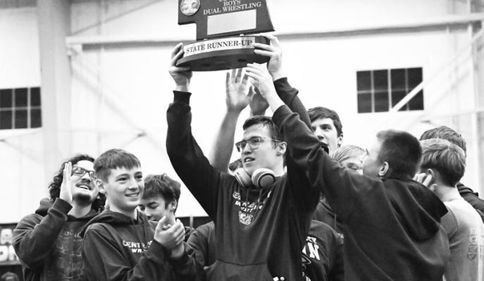 MEMBERS of the Central City High School wrestling team celebrate receiving the runner-up trophy at the NSAA Class C State Dual Wrestling Championships last week in Kearney. The Bison fell to Pierce in the championship dual. Photos by Michael Happ