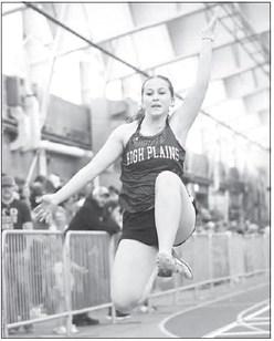 KINLEY SPURLING leaps into the pit during the long jump competition at the University of Nebraska-Kearney.