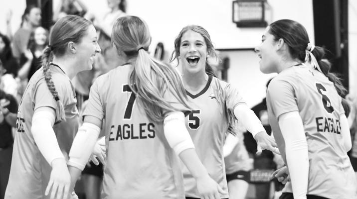 THE NEBRASKA CHRISTIAN EAGLES celebrate after winning a set over High Plains last Thursday. The Eagles defeated the Storm in three sets for their sixth win of the season. Photos by Jordan Coslor