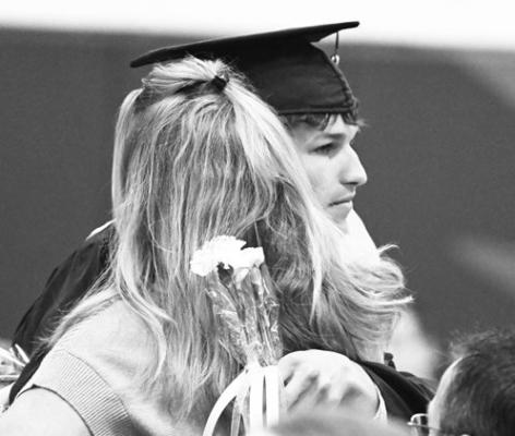 LEVI RUSSELL embraces a loved one during last week’s graduation ceremony at High Plains Community Schools. Thirteen students graduated as a part of the Class of 2026. Photos by Michael Happ