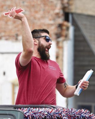 JACOB KENDRICK tossed out popsicles along the parade route during last Saturday’s Lone Tree Days Parade in Central City.