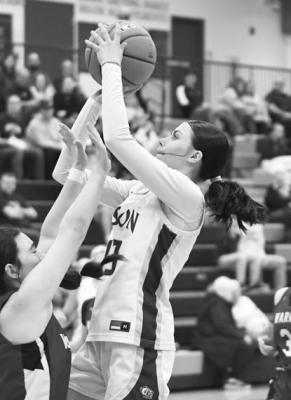 REAGAN FOUSEK scores over a Fullerton defender in last week’s 56-12 win over the Warriors. Fousek led the Bison with twenty-one points in the contest.