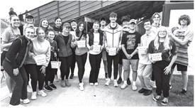 Central City High School DECA participates in the Miracle Minute where students rush through the stands at Bison Stadium collecting as much money as they can in 60 seconds at the last home football game.
