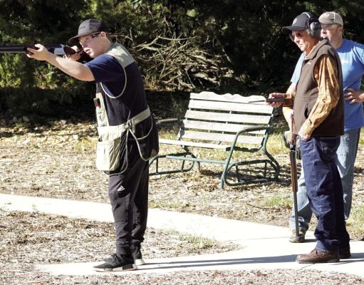 Pull... Saturday was a great day for the Central City Sportsman’s Club to hold their open house celebration and many local residents and then some, turned out for a fun day outdoors. Kaleb Thomas takes aim on the skeet range while Gary Green and Brian Thomas look on. (R-N photo by Jacob Kennedy)